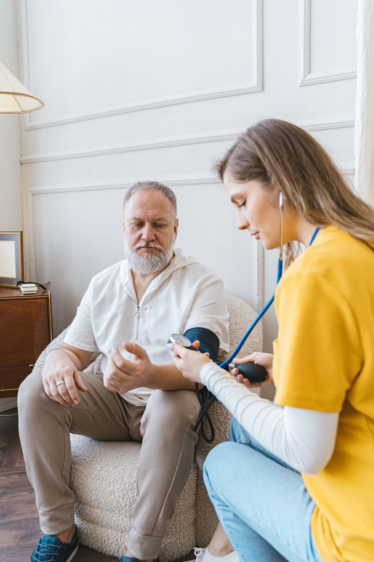 Community nurse visiting an older man at home