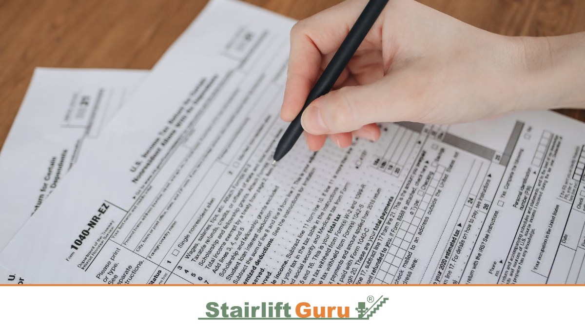 Stairlift Guru grants featured image 2 Filling in a form with a pen