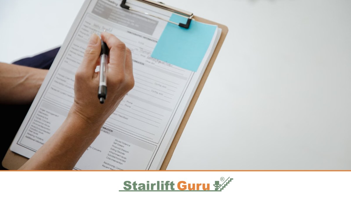 Stairlift Guru grants featured image 5 Filling in a form with a pen