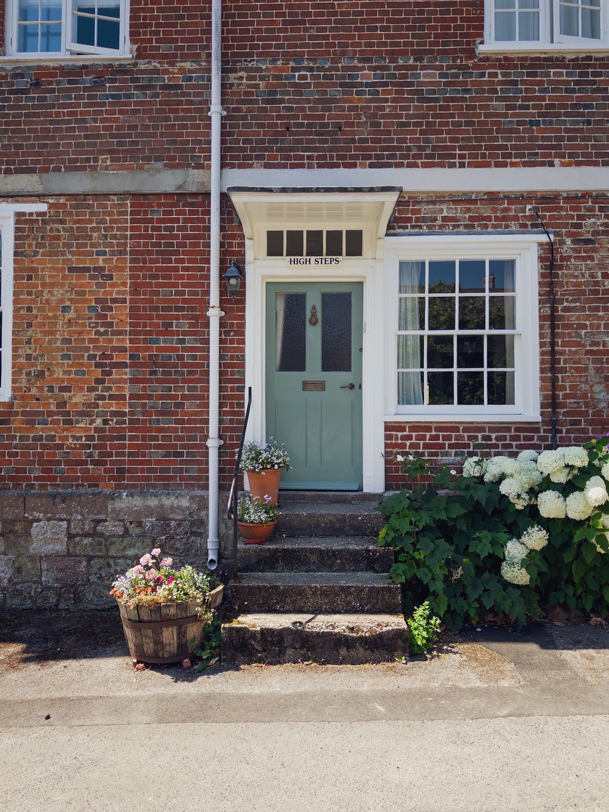 Brick house in the UK with steps leading to the front door
