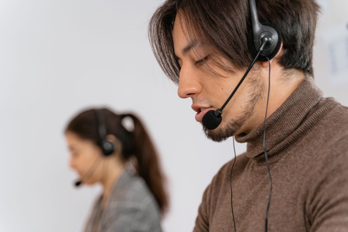 A call centre adviser wearing a headset