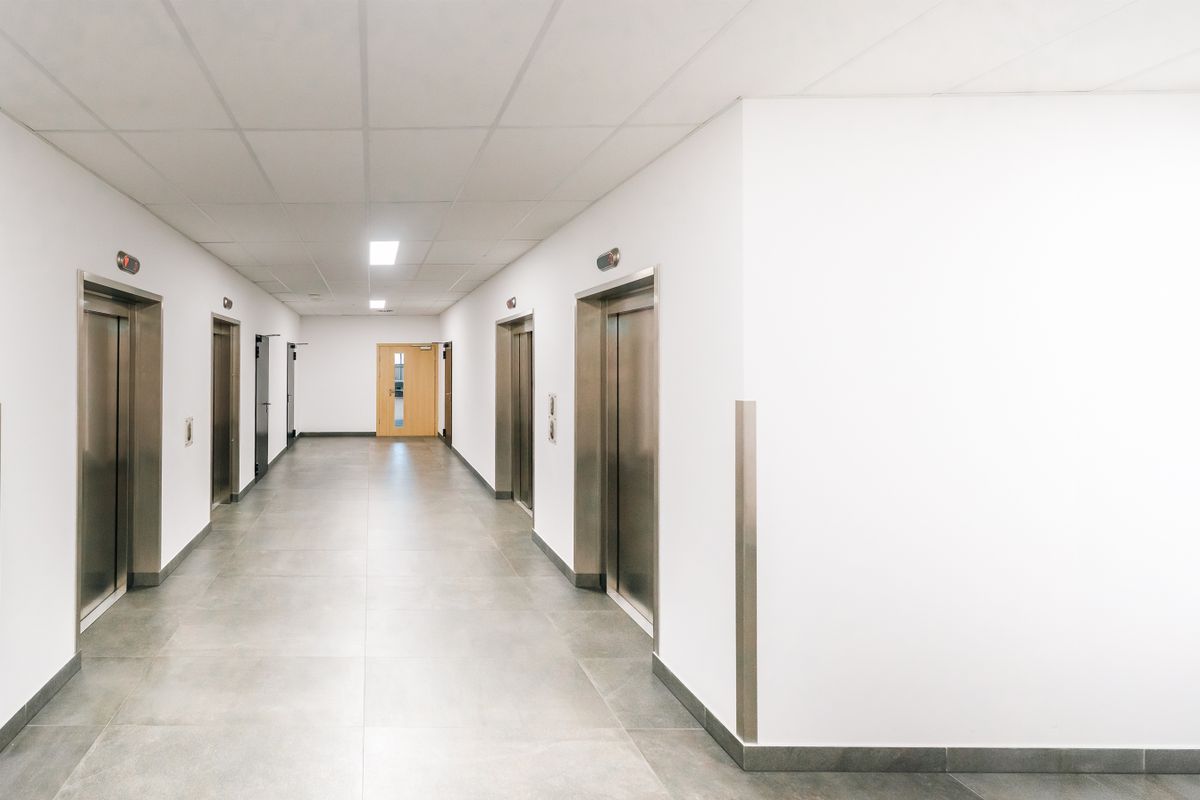 A corridor with lift doors A corridor with lift doors