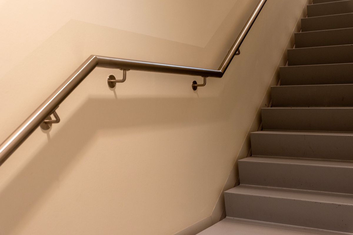 A handrail fitted along a staircase A handrail fitted along a staircase