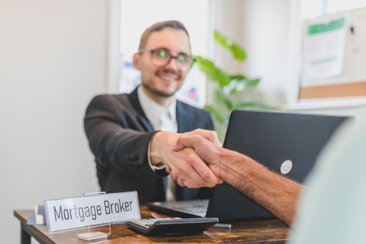 A handshake across a desk