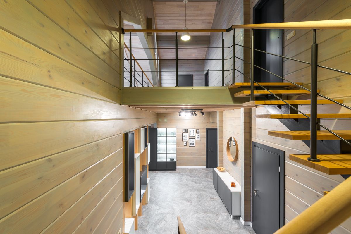 A narrow staircase in a modern interior A narrow staircase in a modern interior