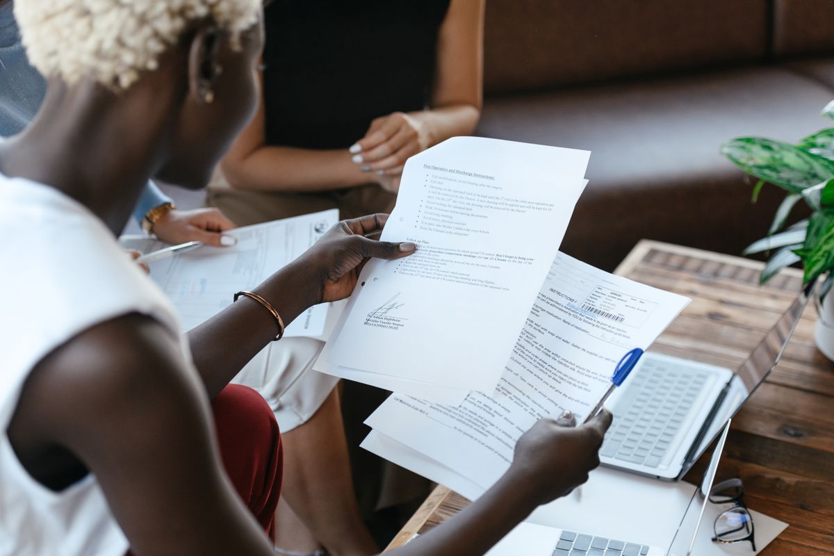 A person going through paperwork A person going through paperwork