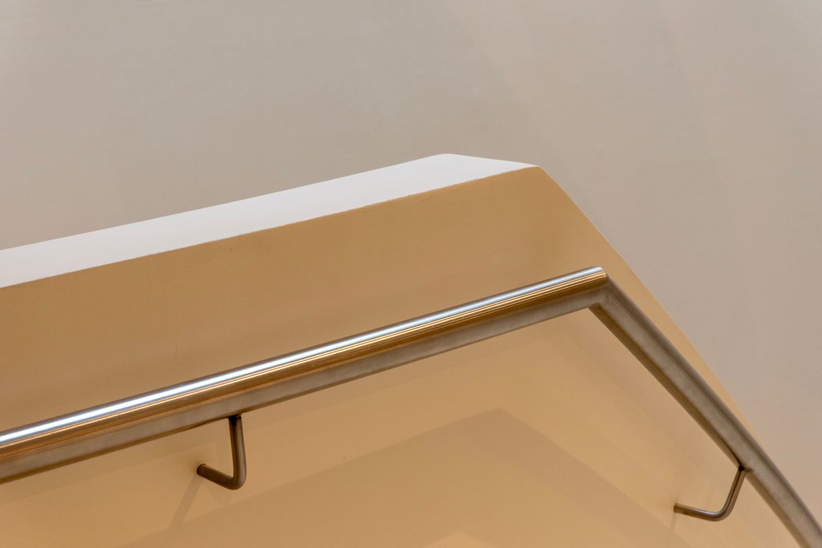 A wooden handrail on a staircase
