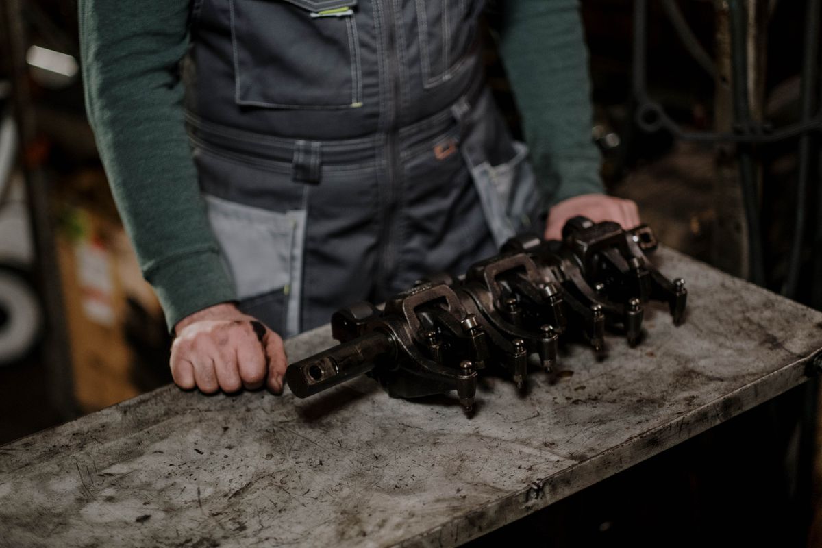 An engineer handling refurbished machine parts An engineer handling refurbished machine parts