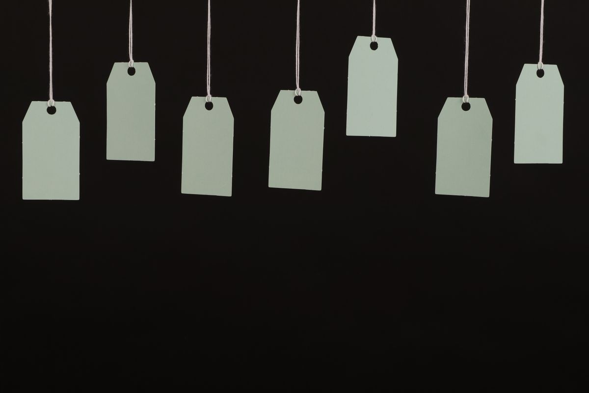 Blank price tags hanging on a line Blank price tags hanging on a line
