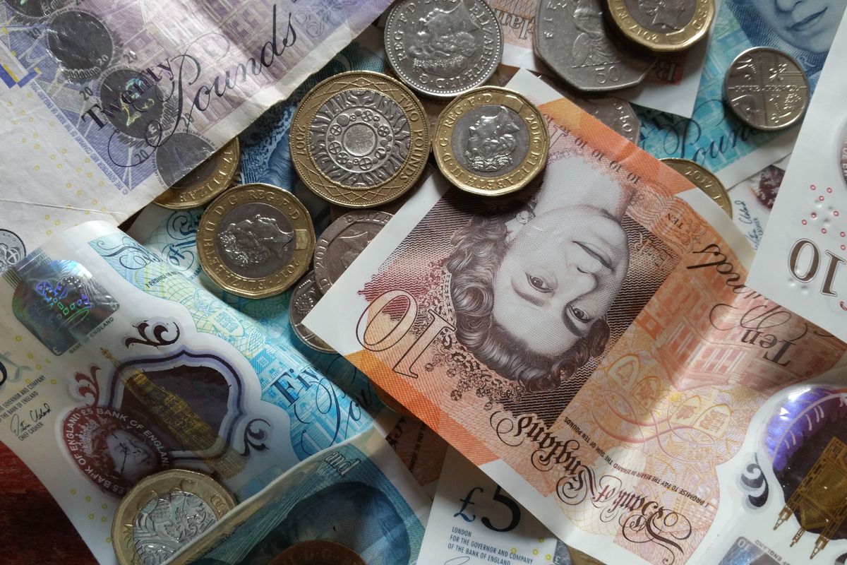 British banknotes and pound coins British banknotes and pound coins
