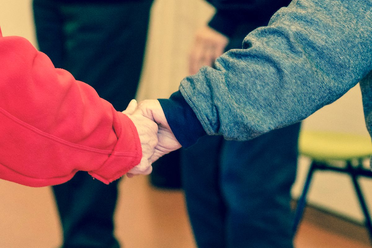 A carer supporting an older person at home A carer supporting an older person at home