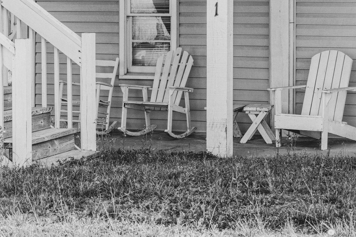 Empty chairs on a porch Empty chairs on a porch