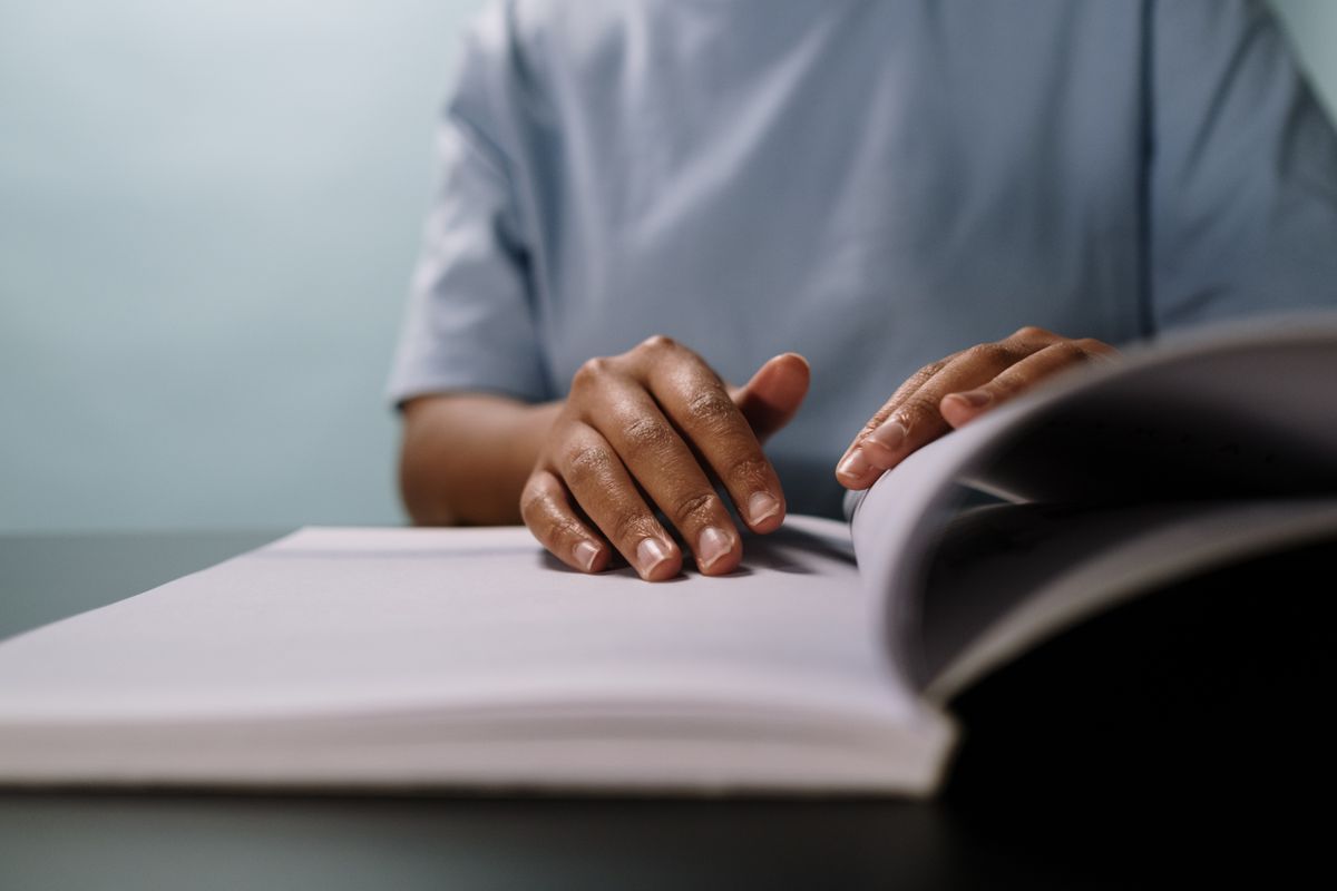 Hands writing notes in a notebook Hands writing notes in a notebook