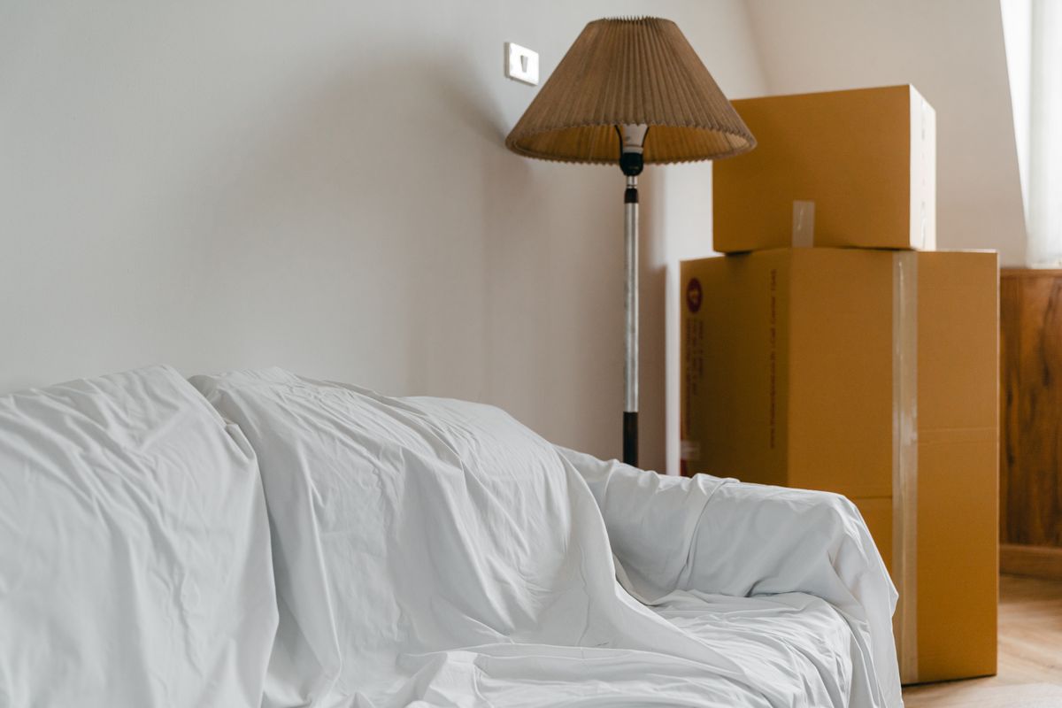 Moving boxes stacked in a bedroom