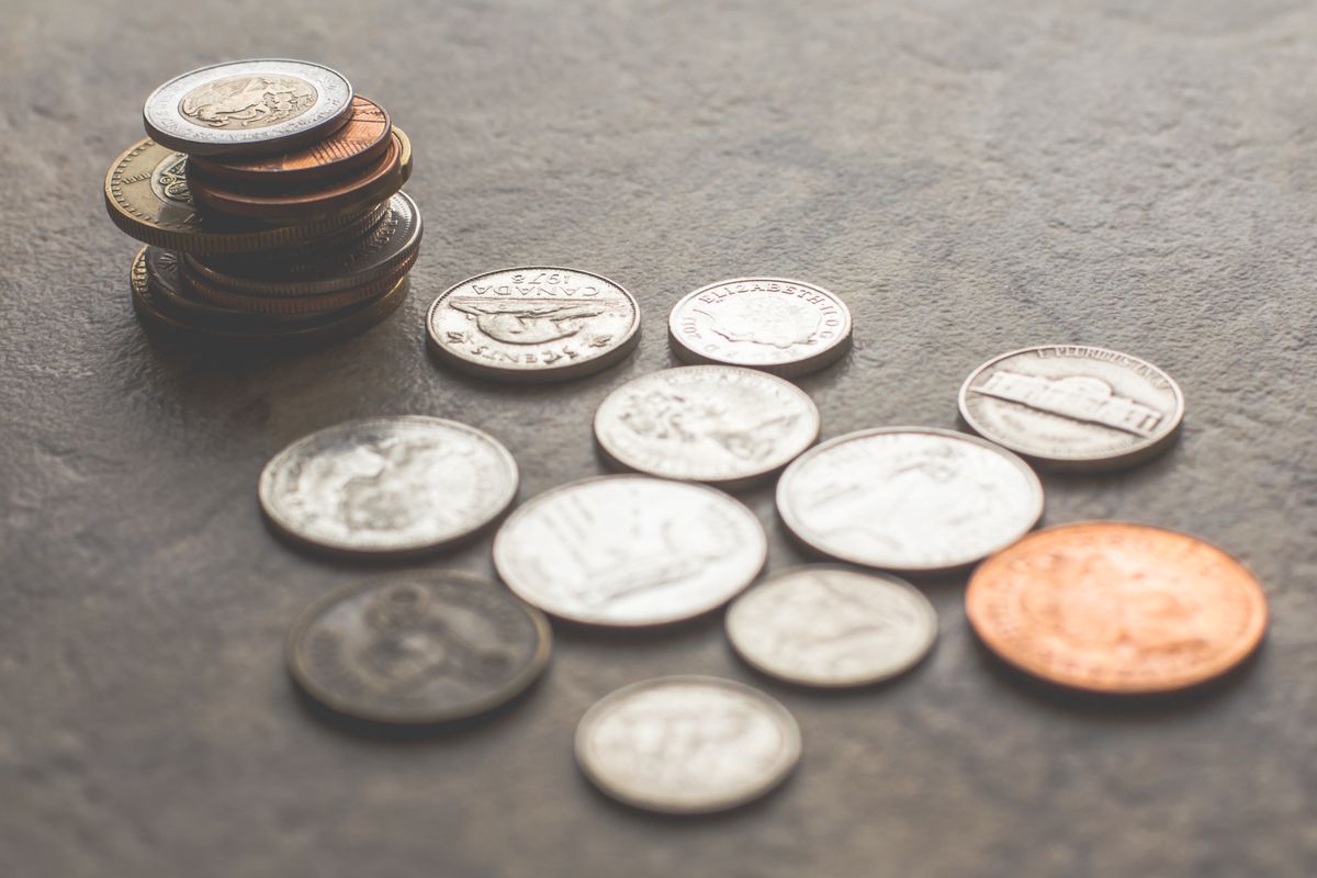 Piles of coins on a surface