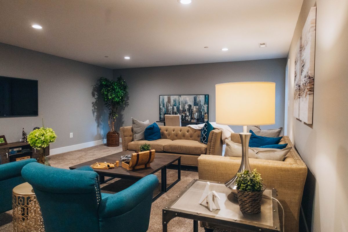 A resident sitting in a care home lounge A resident sitting in a care home lounge