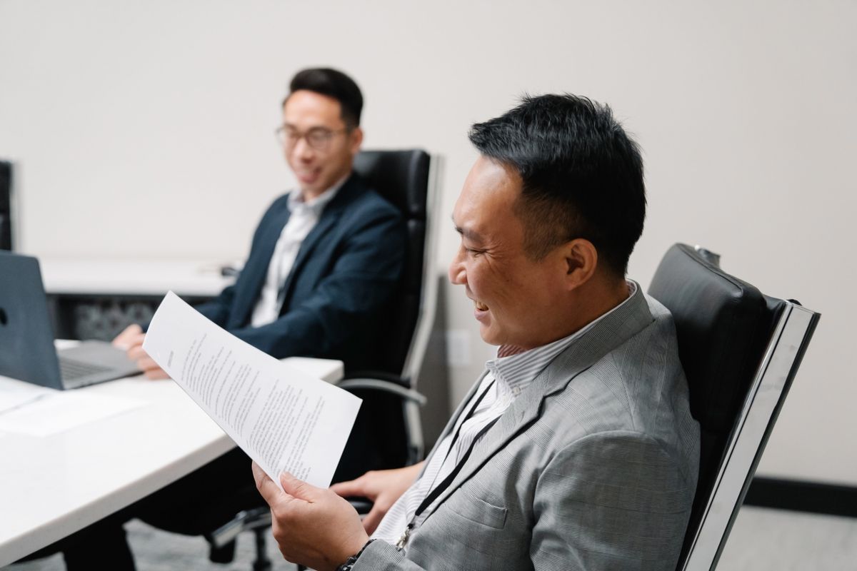 Two people reviewing documents Two people reviewing documents