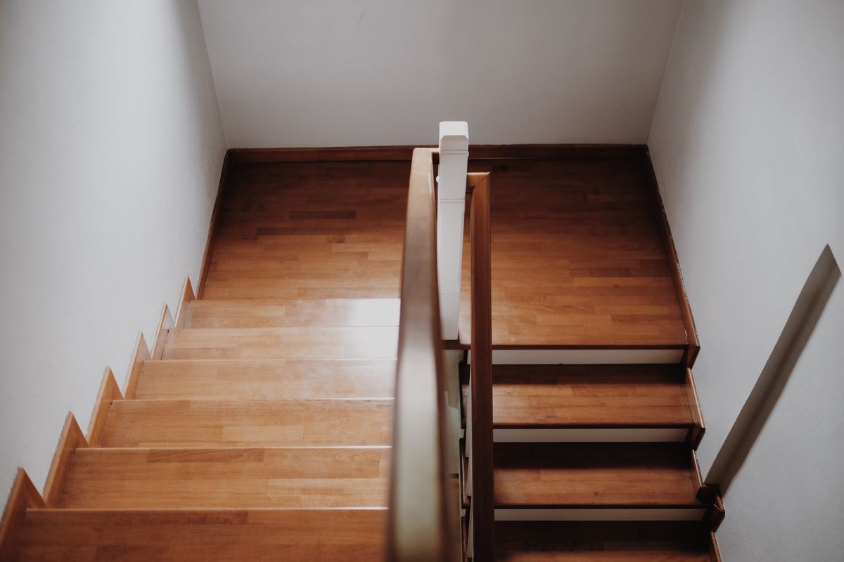 A wooden staircase inside a home A wooden staircase inside a home